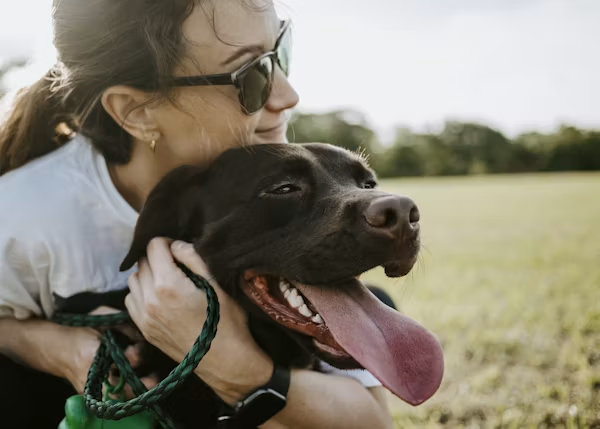 hugging dog